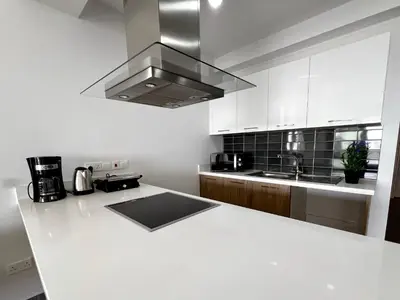 a kitchen with a white counter top and a stove at Rachel 401 in Larnaka