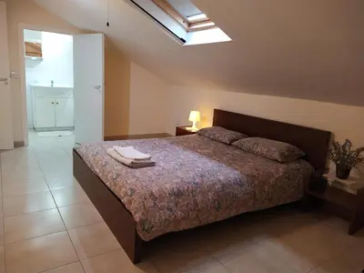 a bedroom with a bed with towels on it at The Tower Penthouse in Strovolos