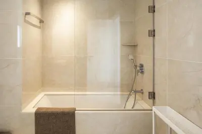 a bathroom with a bath tub and a shower at New Luxury 2BR Seaview Apt, Sun City, Pool and Beach in Ayia Napa