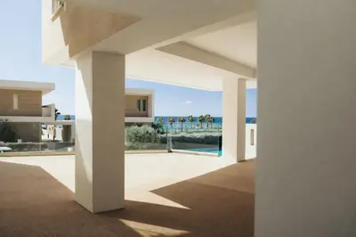 a view from the courtyard of a house at New Luxury 2BR Seaview Apt, Sun City, Pool and Beach in Ayia Napa