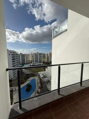 a balcony with a view of a river and buildings at Caesar Resort & SPA & Apartments Spacious Studio in Avgorou