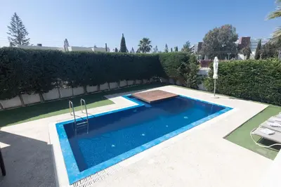 a swimming pool in the middle of a yard at Ayia Napa Satin Villa SVI1 in Ayia Napa