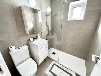 a bathroom with a toilet and a shower and a sink at STAY Ease Apartment in Ayia Napa