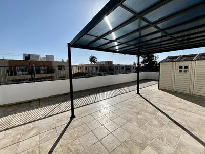 a view of a patio with a roof at STAY Ease Apartment in Ayia Napa