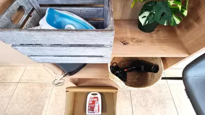 a drawer in a wooden box with tools in it at 2 Cozy Apts, Fast Internet, 5 Min Walk to Beach! in Larnaka