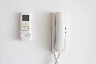 a nintendo wii controller hanging on a wall at Cozy Apartment with Sea View in Larnaka