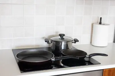 a pot sitting on top of a stove at Cozy Apartment with Sea View in Larnaka