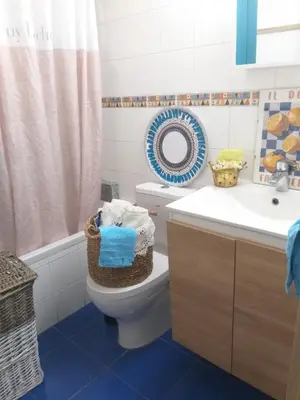 a bathroom with a toilet and a sink at Amathounta Mare Vista Maison in Limassol