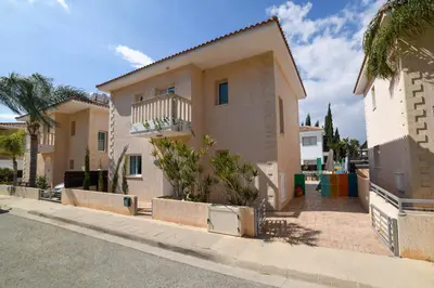 a house with a fence in front of it at Chromata means colorful for a much-needed sunny escape, check your stay! in Protaras