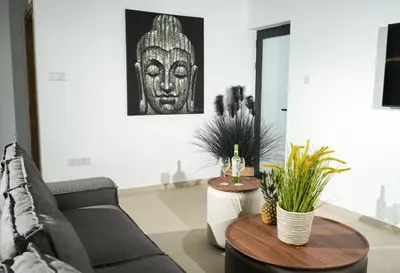 a living room with a couch and two tables at 4BR BrandNEW LUX Villa Protaras in Paralimni