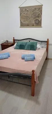 a large bed with two pillows on top of it at Makenzy Mermaid 2 Bedroom Apartment in Larnaka