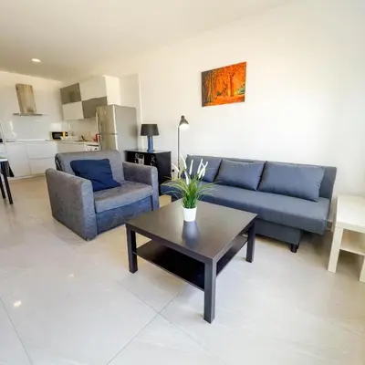 a living room with a couch and a coffee table at Azure Retreat in Ayia Napa