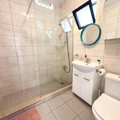 a bathroom with a shower and a sink and a toilet at Azure Retreat in Ayia Napa