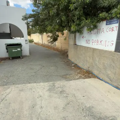 a sign that says no parking next to a wall at Azure Retreat in Ayia Napa