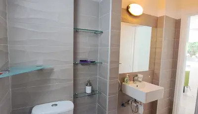a bathroom with a toilet and a sink at Landina villa in Protaras