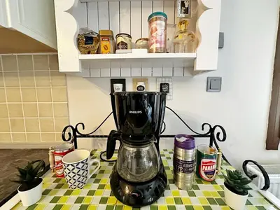 a blender sitting on a counter in a kitchen at Cheerful and cozy Bungalow with pool and fireplace in Athalassa