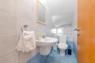 a bathroom with a sink and a toilet at Marika Heights in Ayia Napa