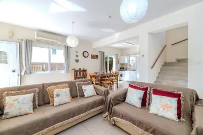 a living room with a couch and a table at Marika Heights in Ayia Napa