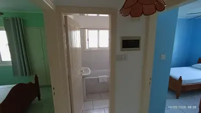 a room with a bathroom with a tub and a bed at Emiliano 7 Holiday Apartment in Larnaka