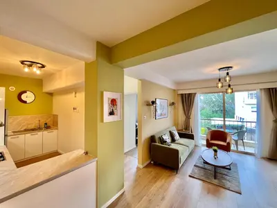 a living room with yellow and green walls at Tropical Cozy 1 - Bedroom Apartment in Limassol
