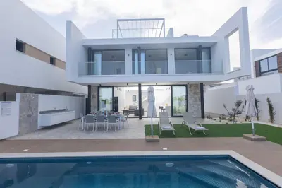 a villa with a swimming pool and a house at Protaras Aqua Villa AQ05 in Protaras