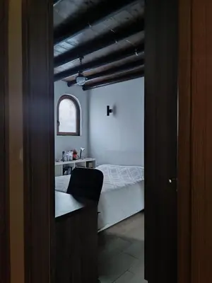 a view of a bedroom with a bed and a window at Stone Garden Oasis Cottage in Limassol