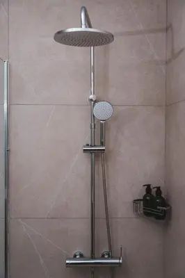 a shower with a shower head in a bathroom at Modern seaview apartment in the heart of Agia Napa in Ayia Napa