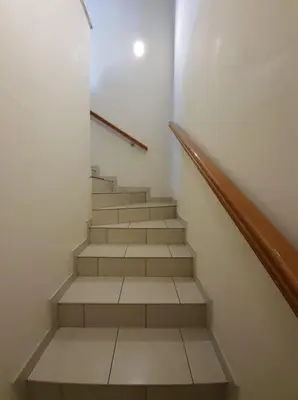 a staircase in a building with a stair case at Bright and Cozy 2-Bedroom Apartment in Strovolos in Strovolos