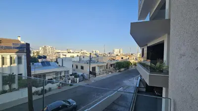 a view of a city street from a building at STAY Larnaca Pearl Apartment in Larnaka