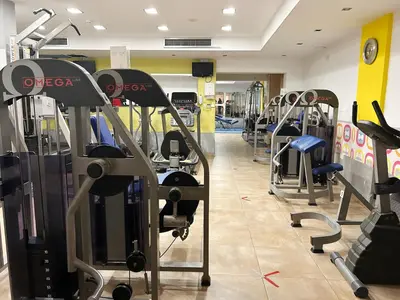 a gym with several treadmills and cardio machines at THE A-LINE SEAVIEW MALAMA APARTMENT with pool, tennis court & gym in Paralimni