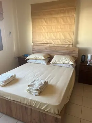 a bedroom with a bed with two towels on it at Tranquil paradise in Aradhippou