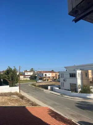 an empty street in a city with buildings at Tranquil paradise in Aradhippou