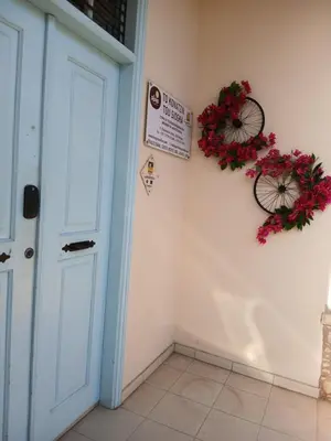 a room with a bike hanging on the wall at Siogkas Inn in Dherinia