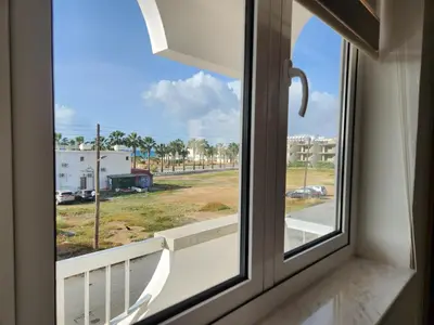 a window with a view of a street at Kafkalia Sea Breeze in Larnaka