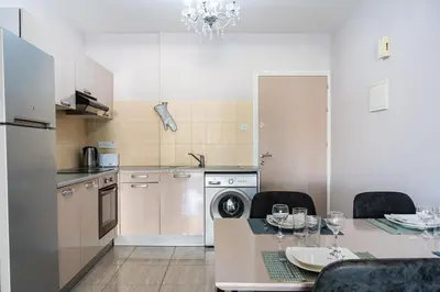 a kitchen with a table with a dining room at Carisa flat, 2 bedrooms in Larnaka