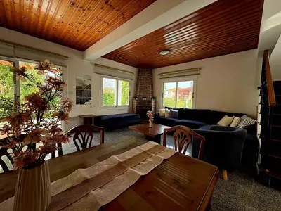 a living room with a couch and a table at Villa Solmare in Pervolia
