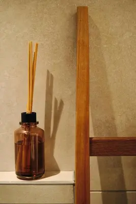 a jar with sticks in it sitting on a shelf at Suite 1003 at Althea Residence in Larnaka