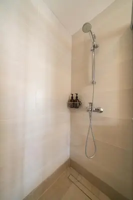 a shower with a shower head in a bathroom at Central Luxurious 2 bedroom flat in Strovolos