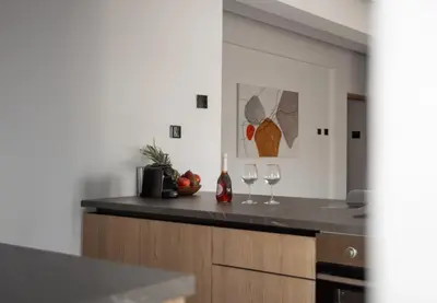 a kitchen with two wine glasses on a counter at Le Bouquet Luxury Suites Ltd in Nicosia