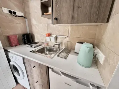 a small kitchen with a sink and a counter at STAY NISSI Chrysland Studios in Ayia Napa