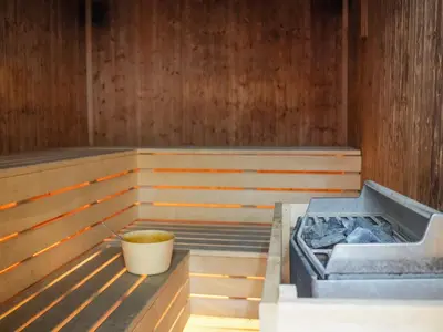 a sauna with a tub with a bucket in it at Mediterranean Escape - Coastal 2-Bedroom Apartment Limassol in Limassol