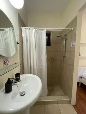 a bathroom with a sink and a shower at Yard room with private entrance in Larnaka