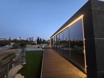 a building with lights on the side of it at Mi Filoxenia 2 in Aglantzia
