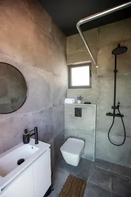 a bathroom with a sink and a toilet and a shower at Mi Filoxenia 2 in Aglantzia