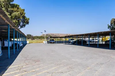 a large parking lot with cars parked in it at Seacret - 1-BR Apartment & Pool in Pyla in Pyla