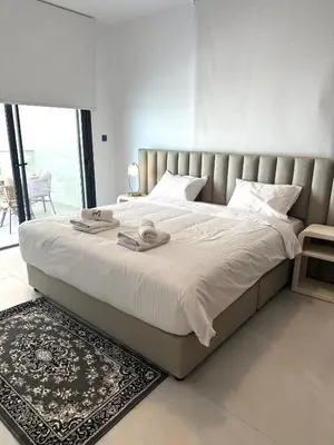 a bedroom with a large bed with a large window at 204 Lux Suites Level2 Tower 206 in Nicosia