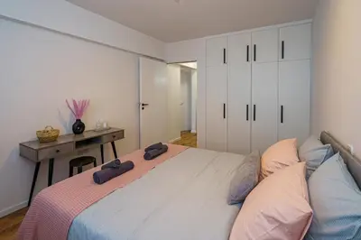 a bedroom with a large bed with two hats on it at Cozy Apartment in Kapparis # 506 in Paralimni