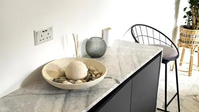 a bowl of rocks on a counter in a kitchen at Luxurious 2BR Apartment in City Center with Internet in Larnaka