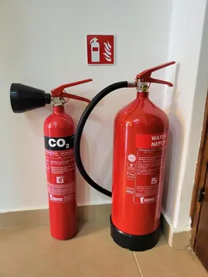 two red fire hydrants sitting next to each other at Sunshine Escape in Larnaka