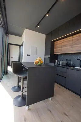 a kitchen with a table and chairs in a room at Mi Filoxenia 1 in Aglantzia